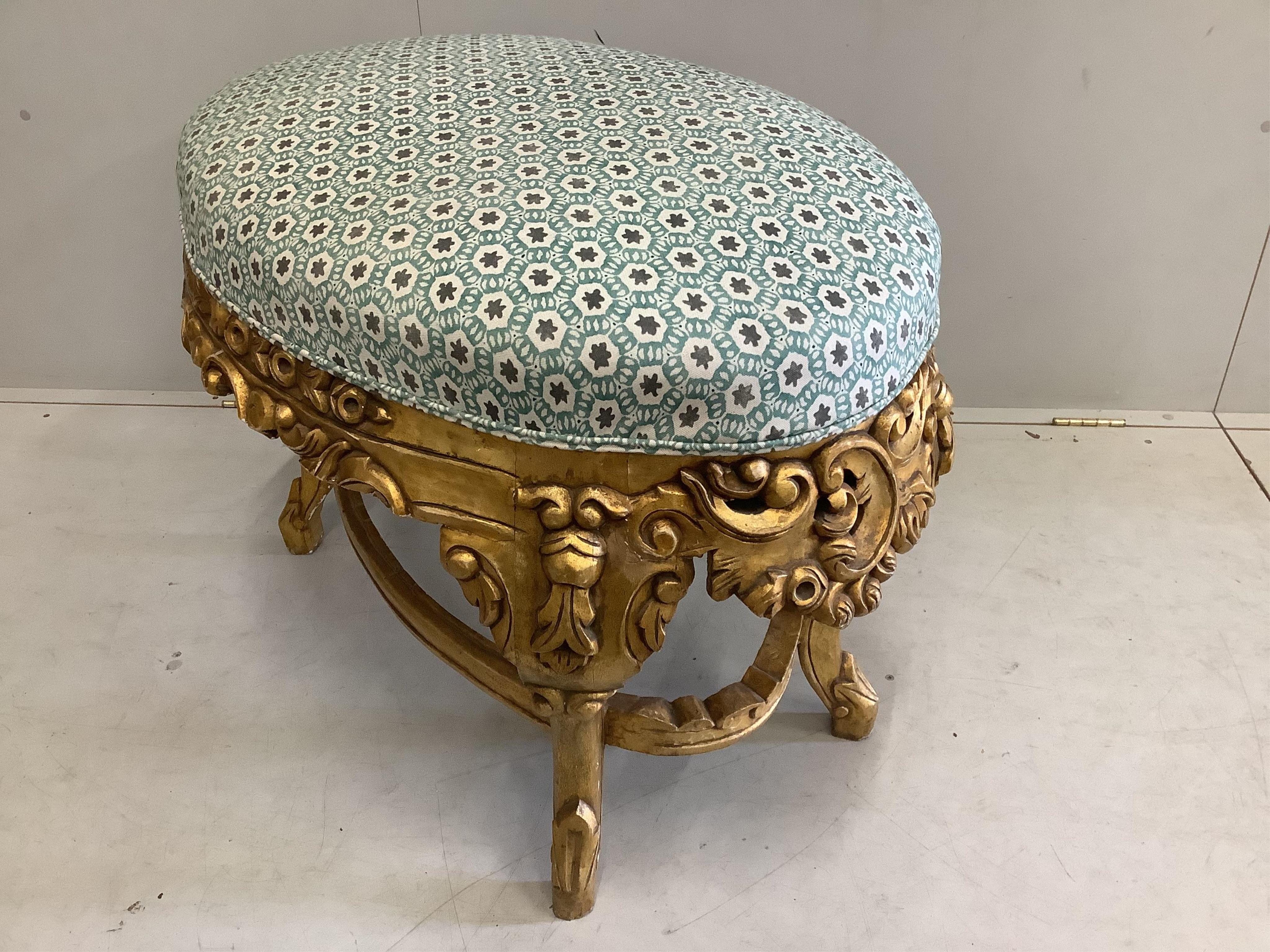 A large 18th century style gilt framed oval stool, width 96cm, depth 60cm, height 60cm. Condition - good